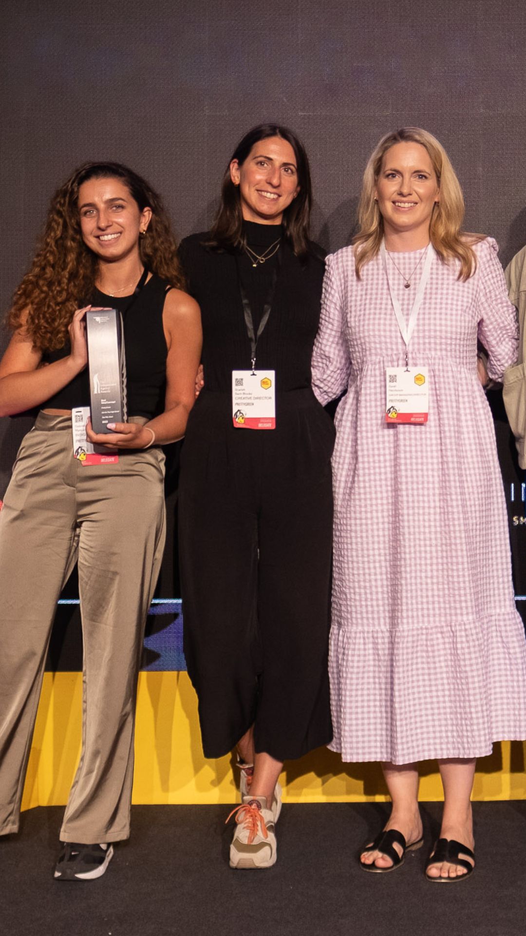 The team on stage holding the award
